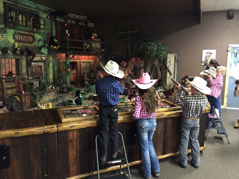 Kid's shooting at the Cody Firearms Experience arcade